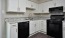 bright kitchen with ample counter space and storage